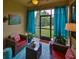 Relaxing screened porch with seating area, perfect for enjoying the outdoors at 314 Bluewater Falls Ct, Apollo Beach, FL 33572