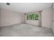 Bright bedroom with large window and carpet flooring at 3201 Belmore Rd, Tampa, FL 33618