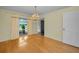 Dining room with hardwood floors and a chandelier at 3201 Belmore Rd, Tampa, FL 33618