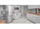 Kitchen with stainless steel refrigerator and white cabinets at 3201 Belmore Rd, Tampa, FL 33618