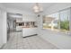 Kitchen with island and view into dining area at 3201 Belmore Rd, Tampa, FL 33618