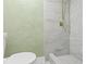 Updated bathroom with a shower and green walls at 3334 Rock Valley Dr, Holiday, FL 34691