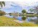 Scenic canal view with lush landscaping and homes at 3334 Rock Valley Dr, Holiday, FL 34691