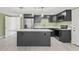 Modern kitchen with stainless steel appliances and an island at 3334 Rock Valley Dr, Holiday, FL 34691