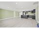 Modern kitchen with dark cabinets and a large island at 3334 Rock Valley Dr, Holiday, FL 34691