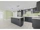 Modern kitchen with stainless steel appliances and an island at 3334 Rock Valley Dr, Holiday, FL 34691