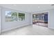 Living room with sliding doors leading to a screened patio at 3334 Rock Valley Dr, Holiday, FL 34691