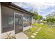 Outdoor screened porch with view of the canal at 3334 Rock Valley Dr, Holiday, FL 34691