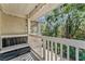 Private balcony overlooking the backyard with a pallet bench at 3406 Waterbridge Dr, Tampa, FL 33618