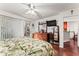 Main bedroom with leafy bedding and a view of the kitchen at 3406 Waterbridge Dr, Tampa, FL 33618