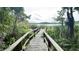 Nature boardwalk leading to a scenic lake view at 3406 Waterbridge Dr, Tampa, FL 33618