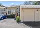 Front view of townhouse with attached garage and landscaping at 3406 Waterbridge Dr, Tampa, FL 33618