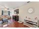 Living room with hardwood floors, a large TV, and ample natural light at 3406 Waterbridge Dr, Tampa, FL 33618