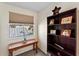 Small home office featuring a wooden desk and bookshelves at 3406 Waterbridge Dr, Tampa, FL 33618