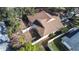 Aerial view showcasing house and backyard with a fenced perimeter at 354 Ixora Dr, Palm Harbor, FL 34684