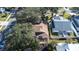 Aerial view showcasing house, backyard, and surrounding neighborhood at 354 Ixora Dr, Palm Harbor, FL 34684