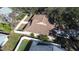 Aerial view showcasing house and backyard with a fenced perimeter at 354 Ixora Dr, Palm Harbor, FL 34684