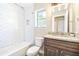 Clean bathroom, featuring a shower/tub combo and granite countertop at 354 Ixora Dr, Palm Harbor, FL 34684