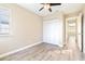 Well-lit bedroom featuring wood-look floors and a built-in closet at 354 Ixora Dr, Palm Harbor, FL 34684