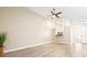 Bright living room with neutral walls, wood-look floors, and a ceiling fan at 354 Ixora Dr, Palm Harbor, FL 34684