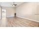 Spacious living room featuring vinyl plank flooring and a ceiling fan at 354 Ixora Dr, Palm Harbor, FL 34684