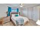 Bright bedroom featuring a comfortable bed, nightstands, and ample closet space at 360 N Bayshore Blvd # 207, Clearwater, FL 33759