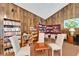 Inviting library area featuring wood-paneled walls, cozy seating, and shelves filled with books at 360 N Bayshore Blvd # 207, Clearwater, FL 33759