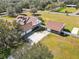 Aerial view of house, detached garage, and large yard at 3717 Quail Nesting Pl, Plant City, FL 33565