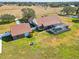 Aerial view showcasing home, detached garage, and expansive grounds at 3717 Quail Nesting Pl, Plant City, FL 33565