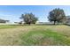 Large grassy backyard with mature trees at 3717 Quail Nesting Pl, Plant City, FL 33565