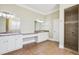 Elegant bathroom with double vanity and walk-in shower at 3717 Quail Nesting Pl, Plant City, FL 33565