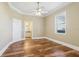 Well-lit bedroom with hardwood floors and ensuite bathroom at 3717 Quail Nesting Pl, Plant City, FL 33565