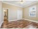 Spacious bedroom with hardwood floors and double doors at 3717 Quail Nesting Pl, Plant City, FL 33565