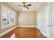 Bright bedroom with hardwood floors, plantation shutters, and double closets at 3717 Quail Nesting Pl, Plant City, FL 33565