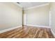 Bright bedroom with hardwood floors and neutral walls at 3717 Quail Nesting Pl, Plant City, FL 33565