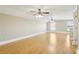 Spacious bonus room with hardwood floors and two ceiling fans at 3717 Quail Nesting Pl, Plant City, FL 33565