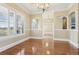 Spacious dining room with hardwood floors and plantation shutters at 3717 Quail Nesting Pl, Plant City, FL 33565