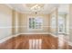 Bright dining room featuring hardwood floors and plantation shutters at 3717 Quail Nesting Pl, Plant City, FL 33565