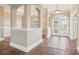 Elegant foyer with tile flooring and arched entryways at 3717 Quail Nesting Pl, Plant City, FL 33565