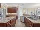 Kitchen features granite countertops and double sinks at 3717 Quail Nesting Pl, Plant City, FL 33565