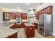 Spacious kitchen with granite counters and stainless appliances at 3717 Quail Nesting Pl, Plant City, FL 33565