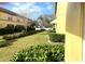 Landscaped backyard with green grass and hedges at 3863 Island Way, St Petersburg, FL 33705