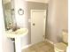 Small bathroom with pedestal sink, toilet, and shower at 3863 Island Way, St Petersburg, FL 33705