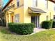 Exterior view of yellow house with landscaping at 3863 Island Way, St Petersburg, FL 33705