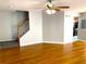 Open living room with hardwood floors and staircase at 3863 Island Way, St Petersburg, FL 33705