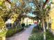 Brick pathway through a community with lush landscaping at 3863 Island Way, St Petersburg, FL 33705