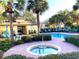 Relaxing community spa and pool area with lounge chairs at 3863 Island Way, St Petersburg, FL 33705