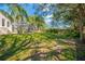 Large backyard with lush grass and mature trees providing shade at 4325 Swift Cir, Valrico, FL 33596