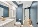 Modern bathroom with updated vanity and a navy blue accent wall at 4325 Swift Cir, Valrico, FL 33596