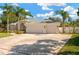 Beautiful home exterior with a three-car garage and palm trees at 4325 Swift Cir, Valrico, FL 33596